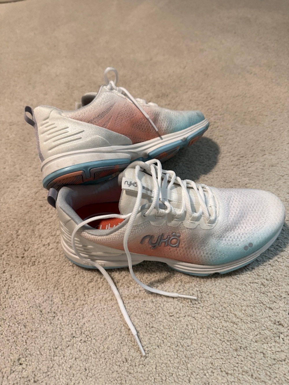 Ryka tennis shoes; worn a couple of times. They are blue/peach/white Size 9.5M